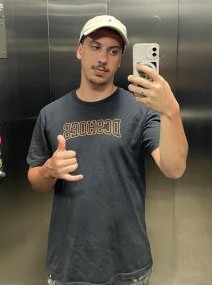 Picture of João Guilherme looking in the mirror